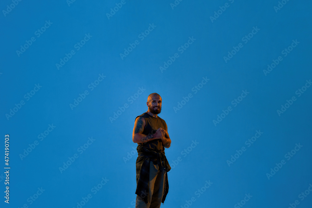 Fototapeta premium Young cool caucasian hip hop dancer look at camera