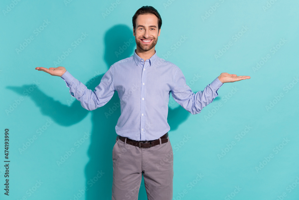Photo of sales manager hands presenting equally valuable options wear purple shirt isolated teal color background Photo of sales manager hands presenting equally valuable options wear purple shirt isolated teal color background