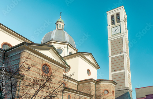 The side of church of Saint Stephen Protomartyr, with bell tower and dome, in Luigi Petazzi square, Sesto San Giovanni, municipality of Milan, Lombardy region, Italy