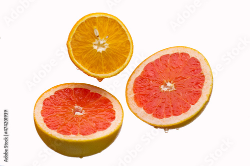 Fresh grapefruit and orange slices  isolated on a white background