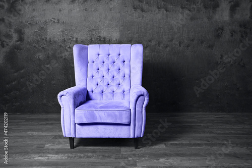 Violet very peri color 2022 armchair over grey background. Trendy color 2021 year. Copy space. 