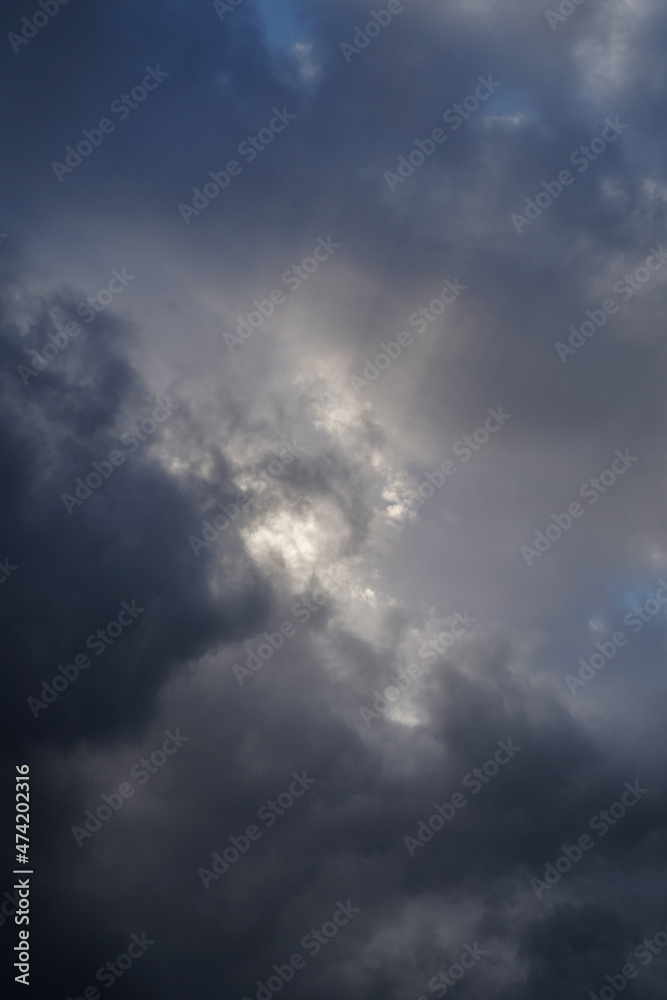 Sun rays in moody clouds