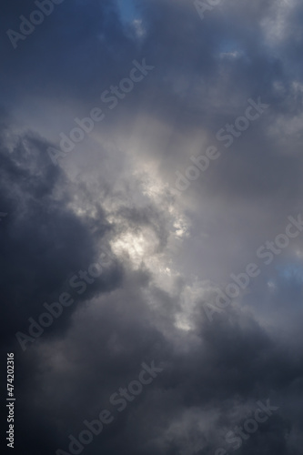 Sun rays in moody clouds