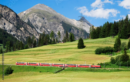The Bernina Express, part of the Rhätische Bahn, near Bergün en route from St. Moritz to Chur in the Swiss canton of Graubünden. photo