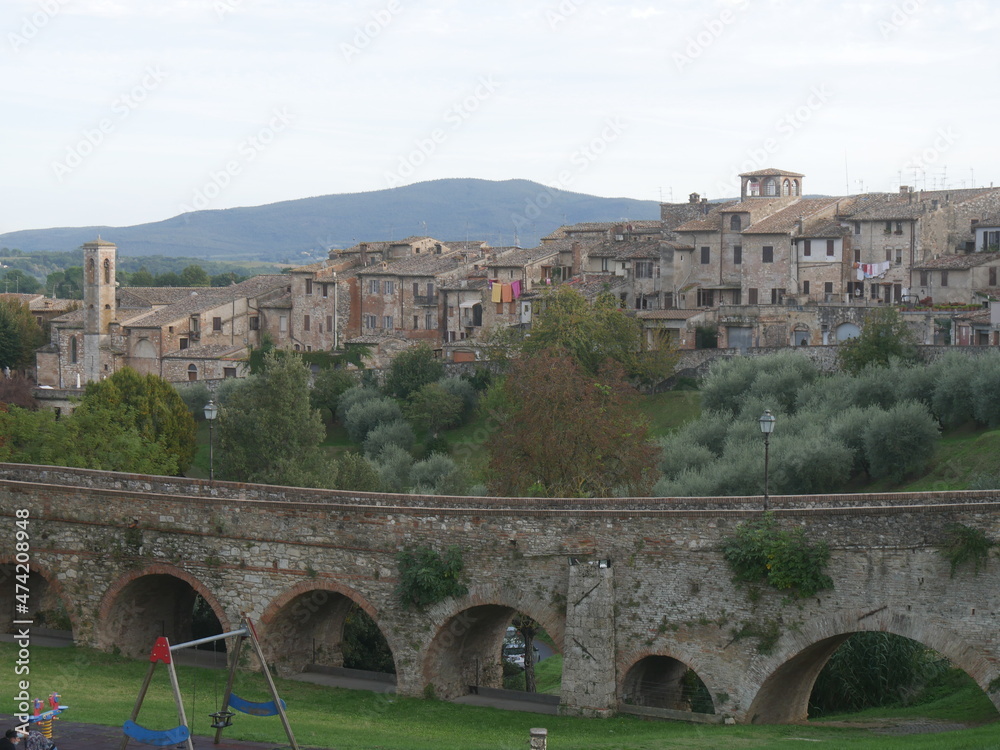 Panorama of Colle di Val d'Elsa, from the fourteenth-century arched bridge, on the medieval part of the village which stands on a hilly ridge alongside a valley