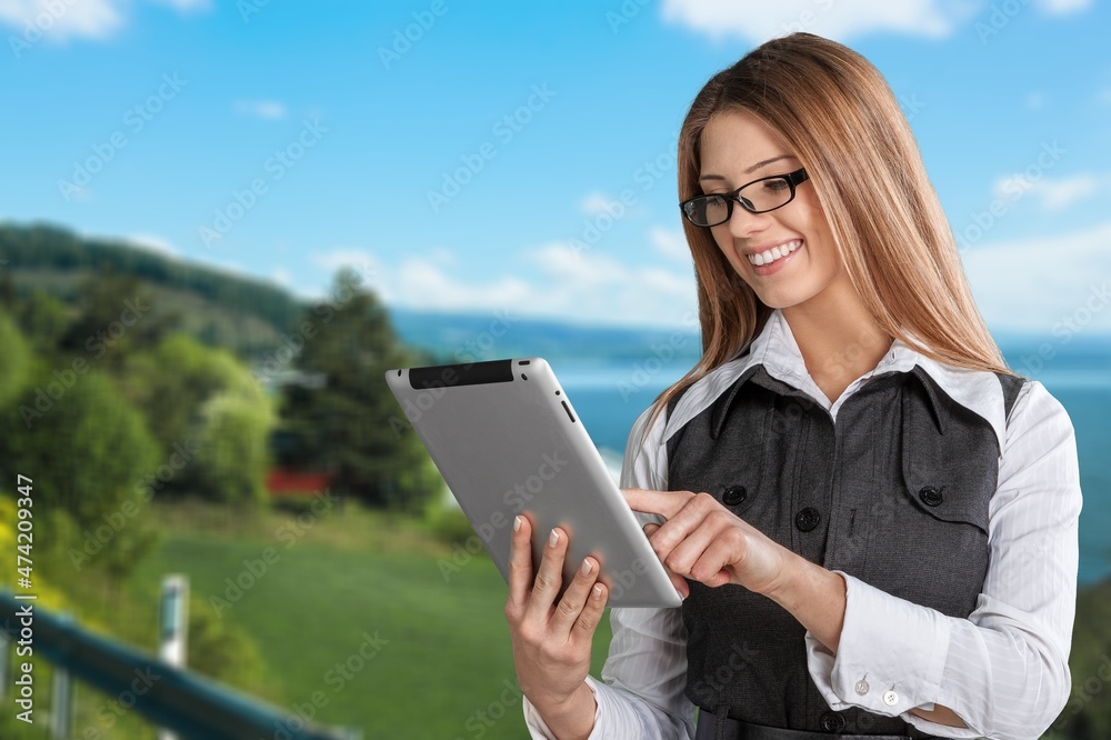 Fototapeta premium Smart young girl teenager student using digital laptop, surfing Internet,