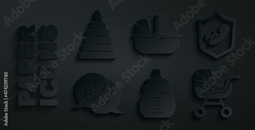 Set Baby bottle, on shield, stroller, and Pyramid toy icon. Vector