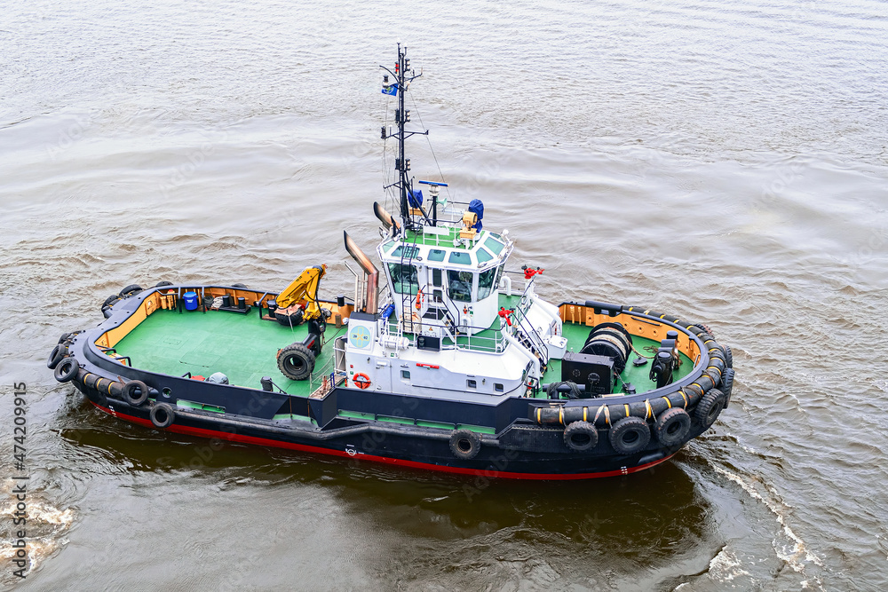 A small tugboat, photographed from the height of a quadcopter. Aerial