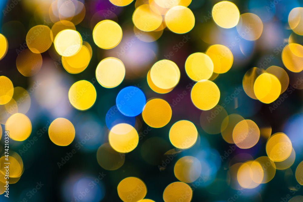 The light bulbs of the electric garland are defocused. The light bulbs of the electric garland are defocused.