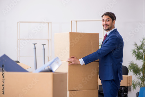 Young male employee in relocation concept