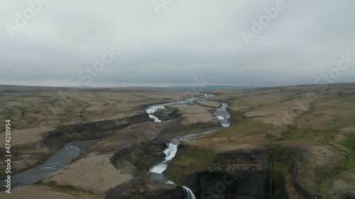 Drone view of Fossa river flowing in Landmannalaugar valley in south Iceland. Aerial top view of Haifoss waterfall, one of the most famous icelandic cascade. Travel destination. Beauty on earth photo