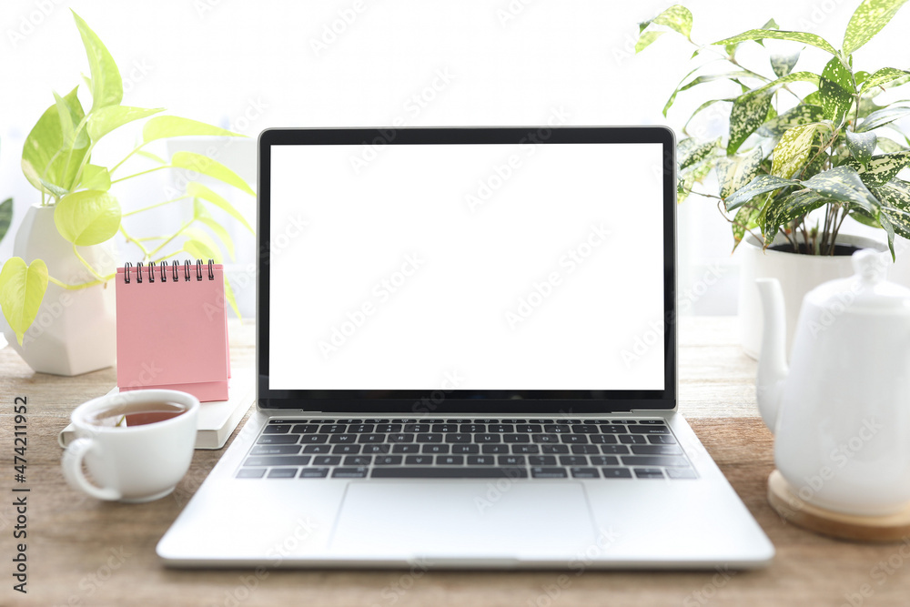 Fototapeta premium Laptop and coffee cup and mini calendar