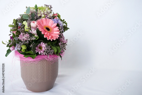 Wallpaper Mural Decorative still life floral composition. Wedding or birthday bouquet of pink and white flowers. White table background. Styled stock photo.  Torontodigital.ca