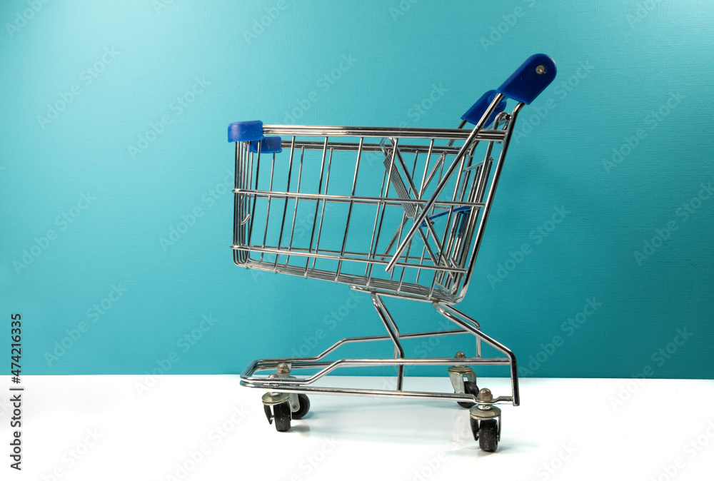 a empty supermarket trolly with white and blue