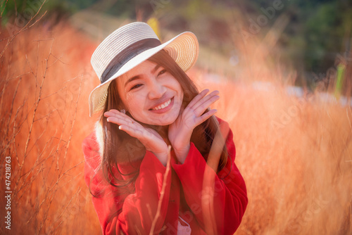Young Asian woman traveler sightseeing on colored meadows in garden at Khao Kho, Phetchabun, Thailand. Relaxing on vacation concept.