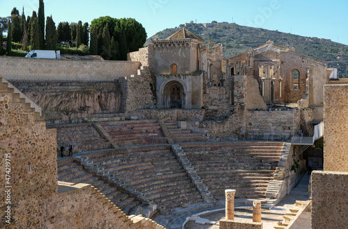 Tela Ruins of ancient Roman amphittheatre with columns, stairs steps and colonnades i