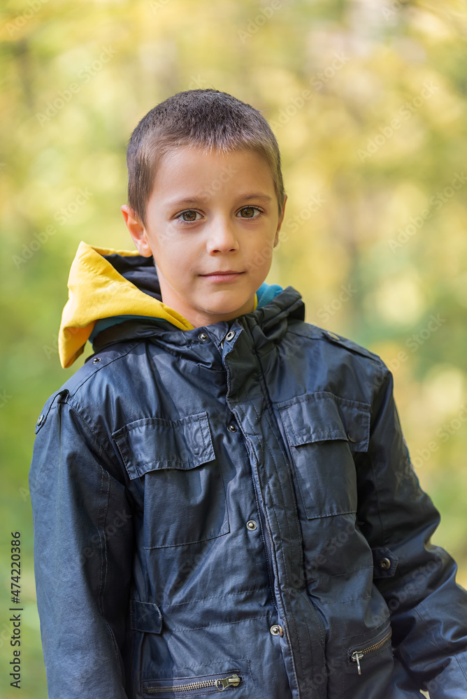 Portrait of boy in the forest smiling to the camera. Portrait of boy in the forest smiling to the camera.