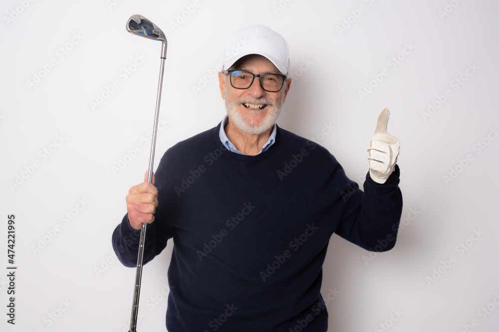 Male golfer showing thumb up isolated on a white background Male golfer showing thumb up isolated on a white background