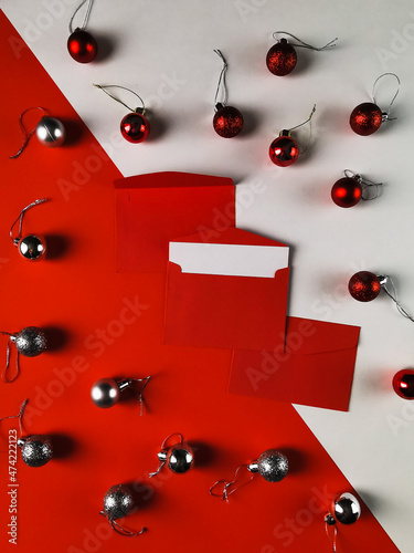 Christmas greeting cards in envelopes on red and white background