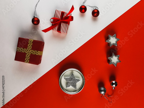 On a red and white background Christmas candles, gift, Christmas balls