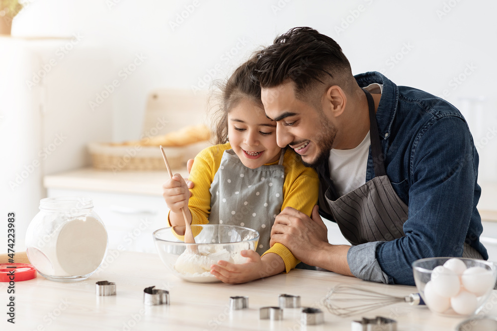 Cute Little Girl Learning How To Make Dough While Baking With Father Cute Little Girl Learning How To Make Dough While Baking With Father