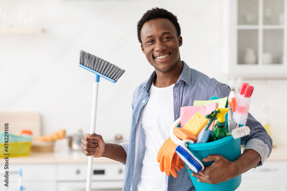 Excited black guy ready for cleaning apartment Excited black guy ready for cleaning apartment