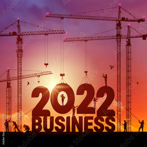 Business in the New Year 2022. Vector illustration business finance background. 2022 construction site crane building a business text idea concept. Black silhouette illustration design.