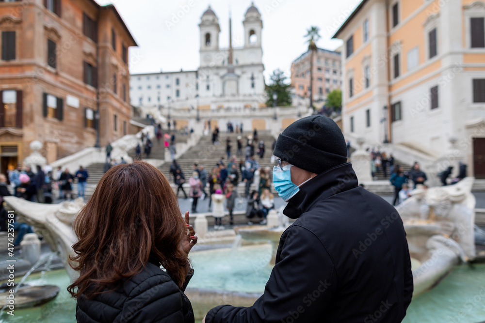 Couple with protective mask in Rome, Italy.