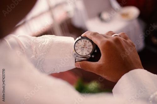 Man's watch on hand. Wedding ceremony	
