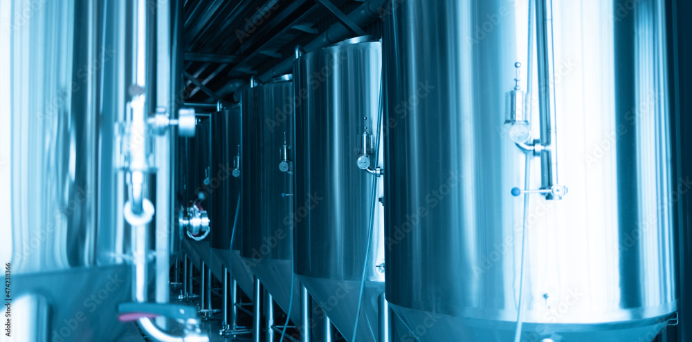 Obraz premium Manometers on steel cylinder storages or vats or tanks on beer and cider production plant, industry machine equipment