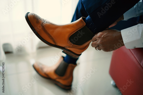 Stylish man in brown shoes 