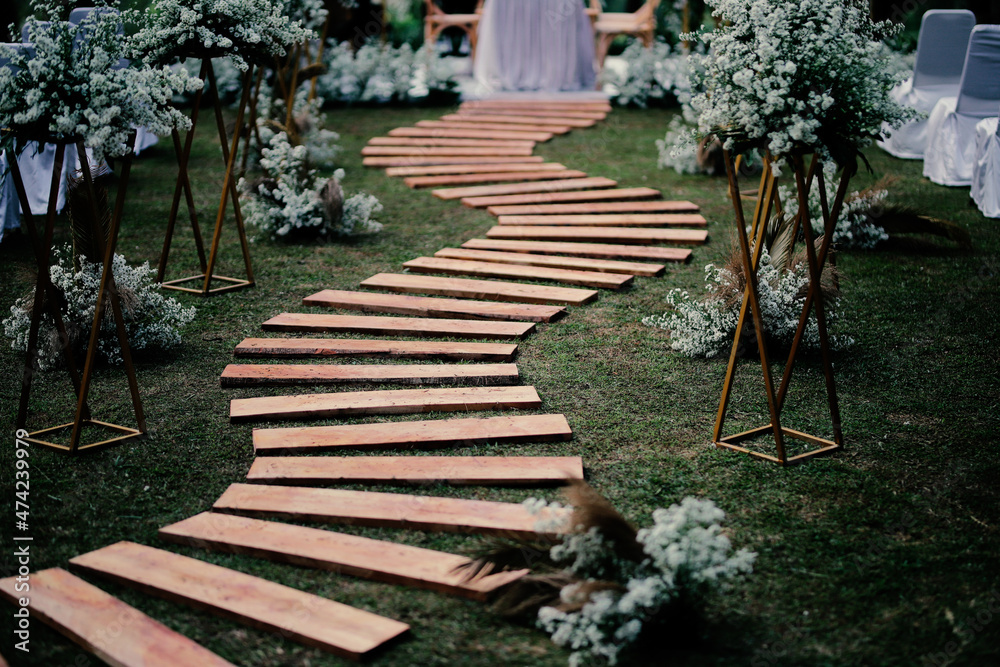 Wedding arch, wedding, wedding moment, wedding decorations, flowers, chairs, outdoor ceremony in the open air, bouquets of flowers
