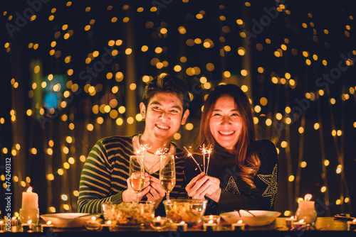 young Asian couple in night...