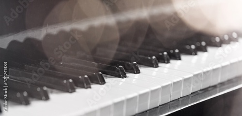 Fotobehang Piano keyboard background. Piano keys with lights