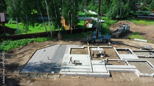 Construction site. Laying of slabs, bricks, concrete mortar. Construction of a cottage.