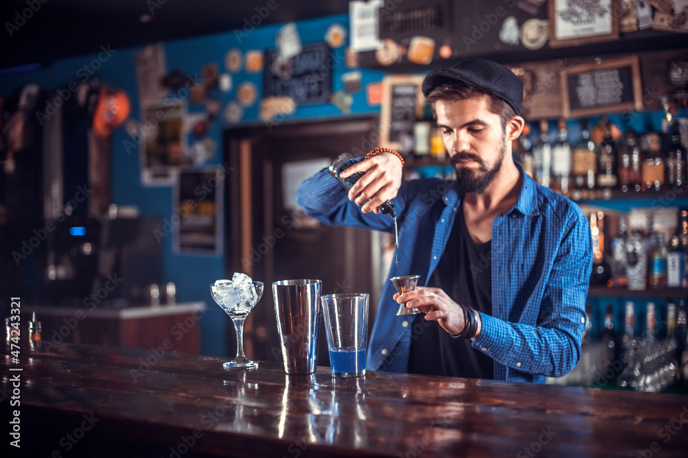 Barman creates a cocktail in the pothouse