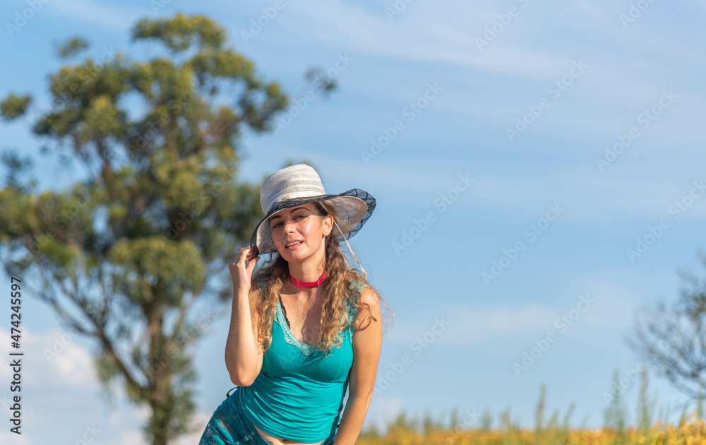 Blonde Brazilian woman posing for photos in rural landscape