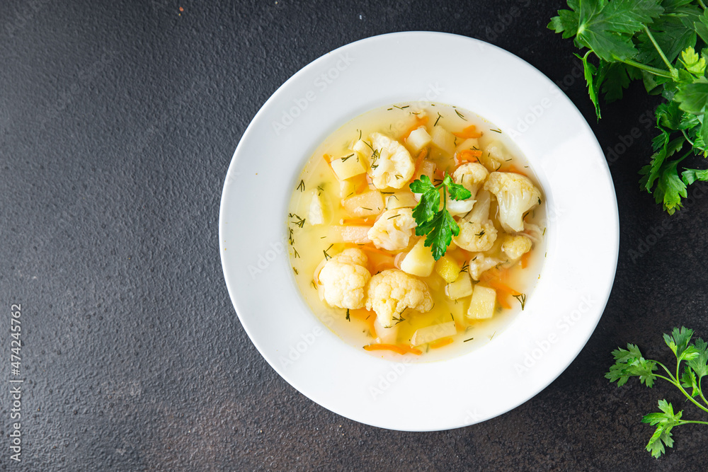 cauliflower soup vegetables first course vegetable broth healthy meal diet snack on the table copy space food background rustic. top view keto or paleo diet veggie vegan or vegetarian food no meat cauliflower soup vegetables first course vegetable broth healthy meal diet snack on the table copy space food background rustic. top view keto or paleo diet veggie vegan or vegetarian food no meat