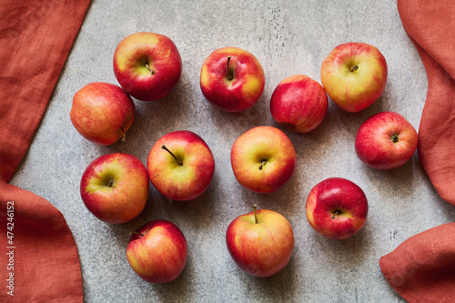 Scattering of fresh ripe red apples in a frame of linen napkins, top view © aleks_g