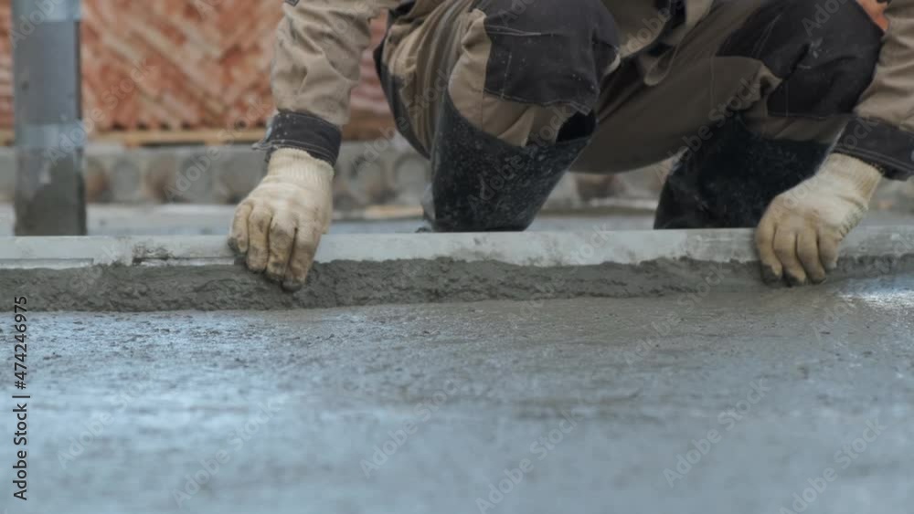 Pouring concrete. Pouring a concrete foundation on a construction site. Construction of a cottage. Pouring concrete. Pouring a concrete foundation on a construction site. Construction of a cottage.