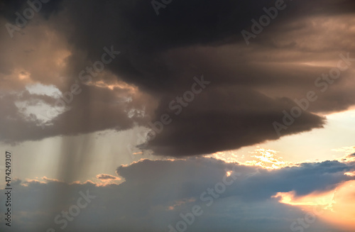 Landscape of dark clouds forming on stormy sky during thunderstorm