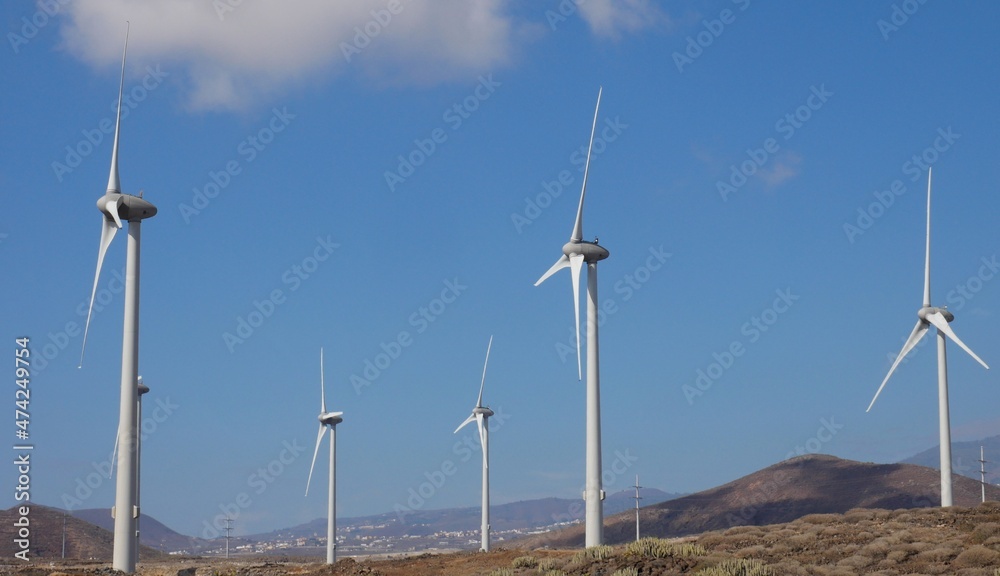 Mountainous landscape and set of wind turbines Mountainous landscape and set of wind turbines