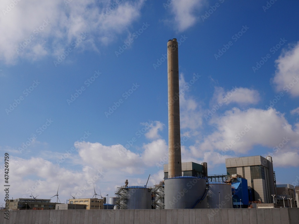 Industrial complex with blue sky and clouds