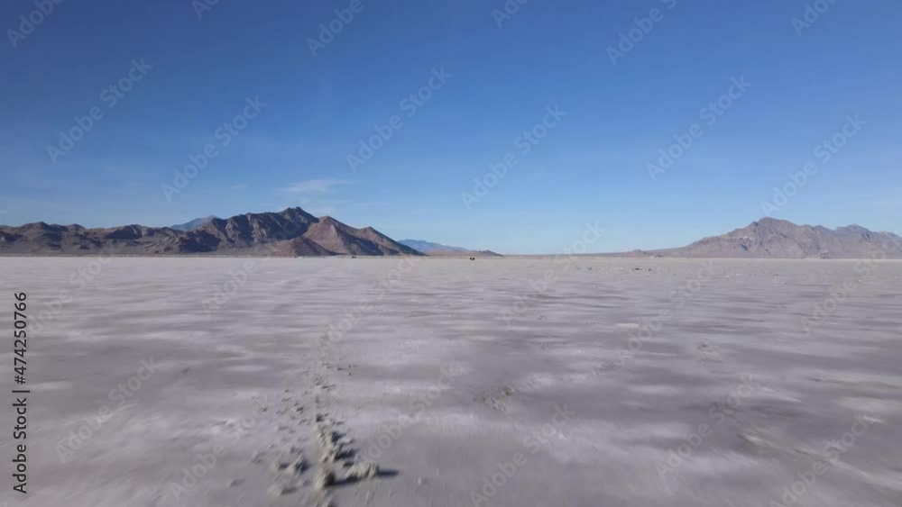 Drone cli of two people eating lunch in the desert Drone cli of two people eating lunch in the desert