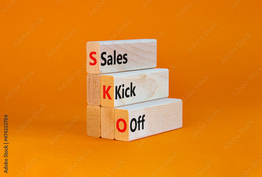 SKO sails kick off symbol. Concept words SKO sails kick off on wooden blocks. Beautiful orange table, orange background, copy space. Business and SKO sails kick off concept. - obrazy, fototapety, plakaty 