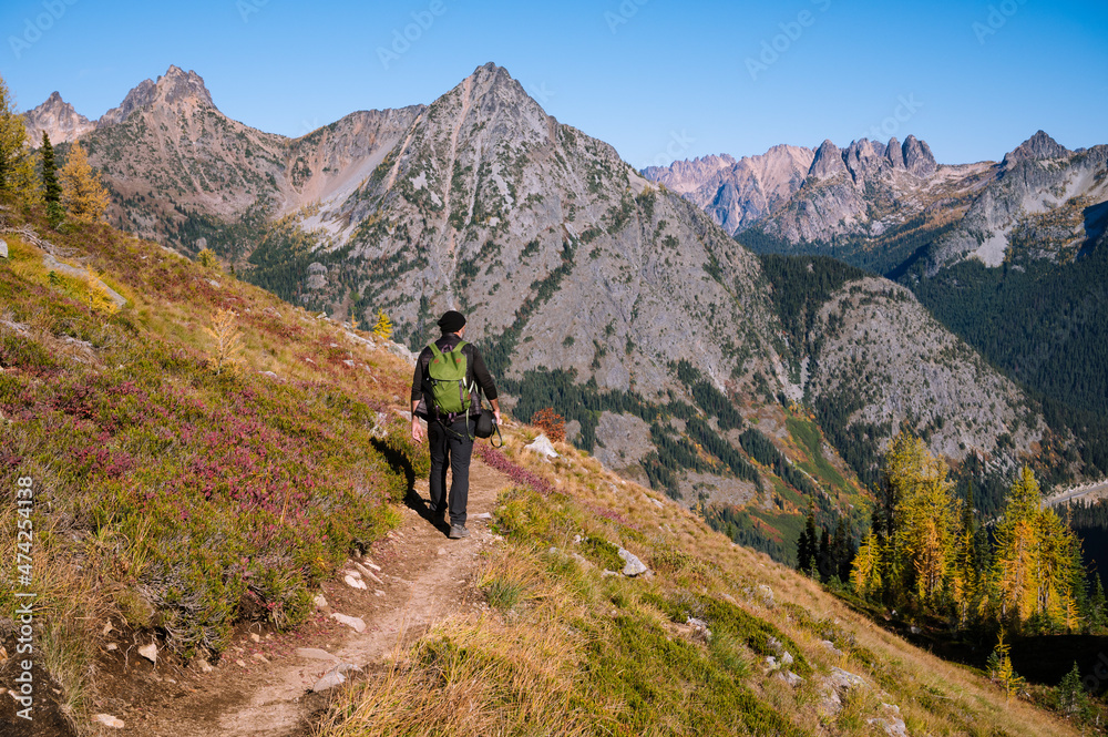 Hiking on a trail in the alpine Hiking on a trail in the alpine