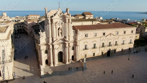 Aerial shot of the Cathedral of Syracuse, Sicily, sea in background photo