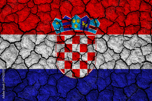 Flag of Croatia over cracked background, conceptual image of crisis
