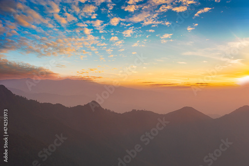 Aerial view of morning mist at tropical rainforest mountain, background of forest and mist, Aerial top view background forest.  © banjongseal324