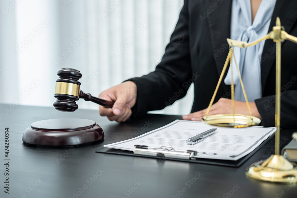 Female lawyer working with legal case document contract in office, law and justice, attorney, lawsuit concept Female lawyer working with legal case document contract in office, law and justice, attorney, lawsuit concept
